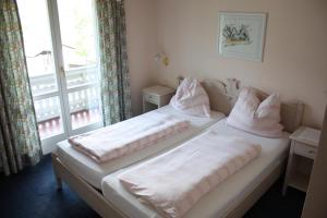 Letto o letti in una camera di Haus Kärnten