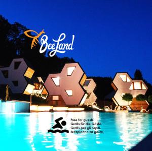 a poster for a resort with a bunch of buildings at Apartments Beeland Skok in Mozirje