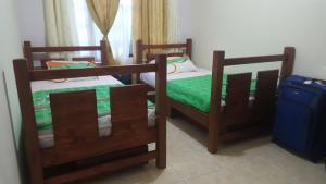 Ένα ή περισσότερα κρεβάτια σε δωμάτιο στο The Clover 20-28