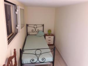A bed or beds in a room at Bilocale jasmin