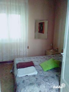 Ein Bett oder Betten in einem Zimmer der Unterkunft Casa Libertà