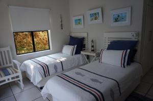 Posteľ alebo postele v izbe v ubytovaní CodsView Beach House