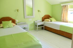 เตียงในห้องที่ Apartments Villa Milna 2