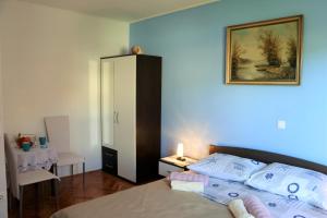 Postel nebo postele na pokoji v ubytování Apartments Milatic
