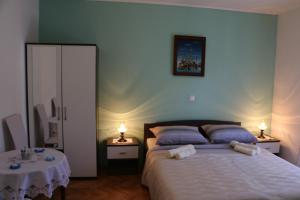Postel nebo postele na pokoji v ubytování Apartments Milatic