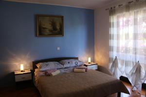 Postel nebo postele na pokoji v ubytování Apartments Milatic