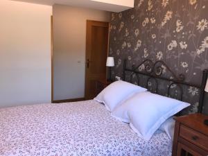 Katil atau katil-katil dalam bilik di APARTAMENTO HORREO - Emilio Laria