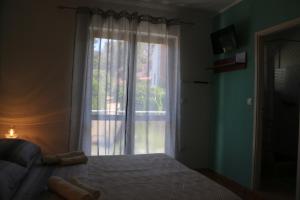 Postel nebo postele na pokoji v ubytování Apartments Milatic