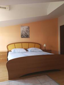 Postel nebo postele na pokoji v ubytování Apartmani "Ivan"