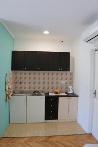 Kuchyň nebo kuchyňský kout v ubytování Apartments Milatic