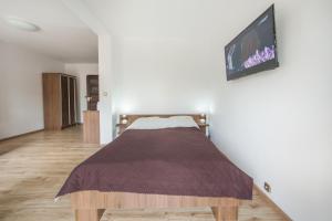 Postel nebo postele na pokoji v ubytování Willa Magda
