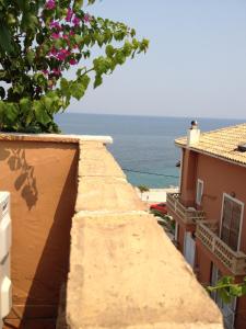 a view of the ocean from the balcony of a building at Yria Hotel in Zakynthos Town