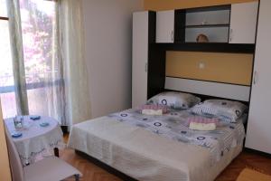 Postel nebo postele na pokoji v ubytování Apartments Milatic