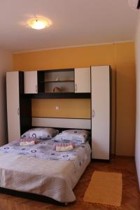 Postel nebo postele na pokoji v ubytování Apartments Milatic
