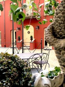 a patio with tables and chairs in front of a building at Porta Palace Apartments in Turin