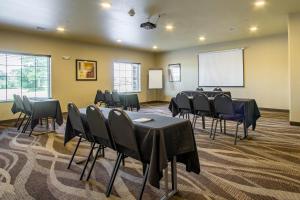 a conference room with tables and chairs and a whiteboard at Cobblestone Hotel & Suites - Orrville in Orrville +31 photos