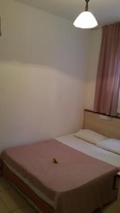 Postel nebo postele na pokoji v ubytování Delphin Apart Hotel