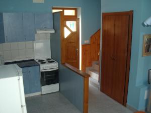 Kuchyňa alebo kuchynka v ubytovaní Sasi Apartmanház