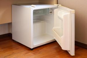 an empty white refrigerator with its door open at Morioka New City Hotel in Morioka +6 photos