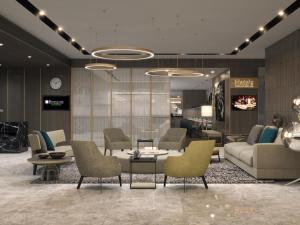 eine Lobby mit Sofas und einem Tisch und Stühlen in der Unterkunft The Branksome Hotel & Residences in Sydney