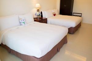 Krevet ili kreveti u jedinici u okviru objekta Na Na Ya Ji Bed and Breakfast