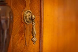 a wooden door with a brass door knocker on it at Bed & Breakfast Vila Baguc in Split