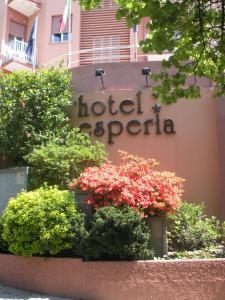 a hotel sigiriya sign on the side of a building at Hotel Esperia in Genoa