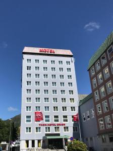 
a large building with a sign on the side of it at Thon Hotel Orion in Bergen
