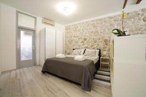 Postel nebo postele na pokoji v ubytování Zen studio in center of Rovinj