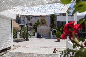 a driveway of a house with a garage at Kohili apartments in Pefkochori