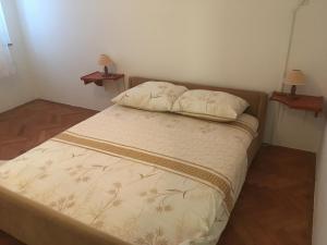 Postel nebo postele na pokoji v ubytování Apartments Ankica