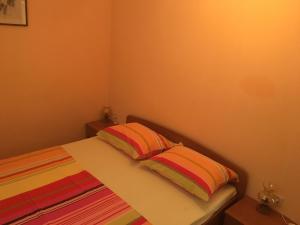 Postel nebo postele na pokoji v ubytování Apartments Ankica