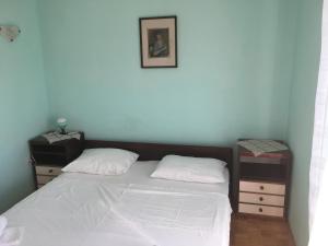 Postel nebo postele na pokoji v ubytování Apartments Ankica