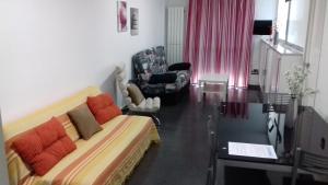TV a/nebo společenská místnost v ubytování Apartamentos Turísticos Los Ángeles