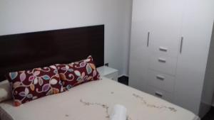 Postel nebo postele na pokoji v ubytování Apartamentos Turísticos Los Ángeles