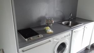 Kuchyň nebo kuchyňský kout v ubytování Apartamentos Turísticos Los Ángeles