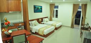 Marvin Hotel & Apartment tesisinde bir odada yatak veya yataklar