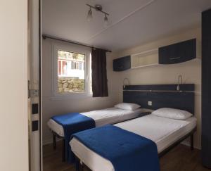 Posteľ alebo postele v izbe v ubytovaní Camping Village Poljana