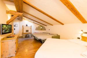 Posteľ alebo postele v izbe v ubytovaní Hotel Pontiglia