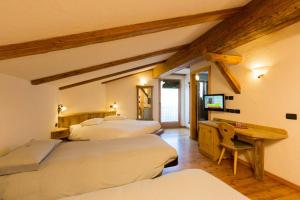 Posteľ alebo postele v izbe v ubytovaní Hotel Pontiglia