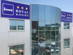 a building with a sign that reads royal rooms at Royal Apartments & Rooms in Zagreb