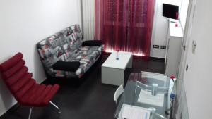TV a/nebo společenská místnost v ubytování Apartamentos Turísticos Los Ángeles