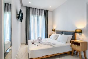 Tempat tidur dalam kamar di Elysian Suites