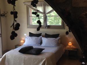 a bedroom with a bed with white sheets and a window at Le Palazze B&b in Chiusi +48 photos