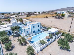 an aerial view of a house with a swimming pool at Studios Apartments Kapetanios in Perissa
