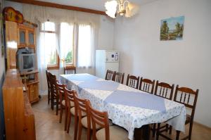 a dining room with a table and some chairs at Kristal Guest House in Trigrad