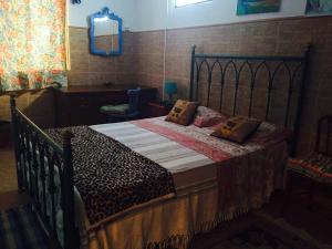 Uma cama ou camas num quarto em Villa Cinthia