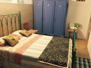 Uma cama ou camas num quarto em Villa Cinthia