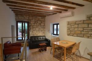 Posedenie v ubytovaní Apartment Il Cortile with garden and parking