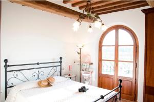 Postel nebo postele na pokoji v ubytování Agriturismo Podere dei kiwi